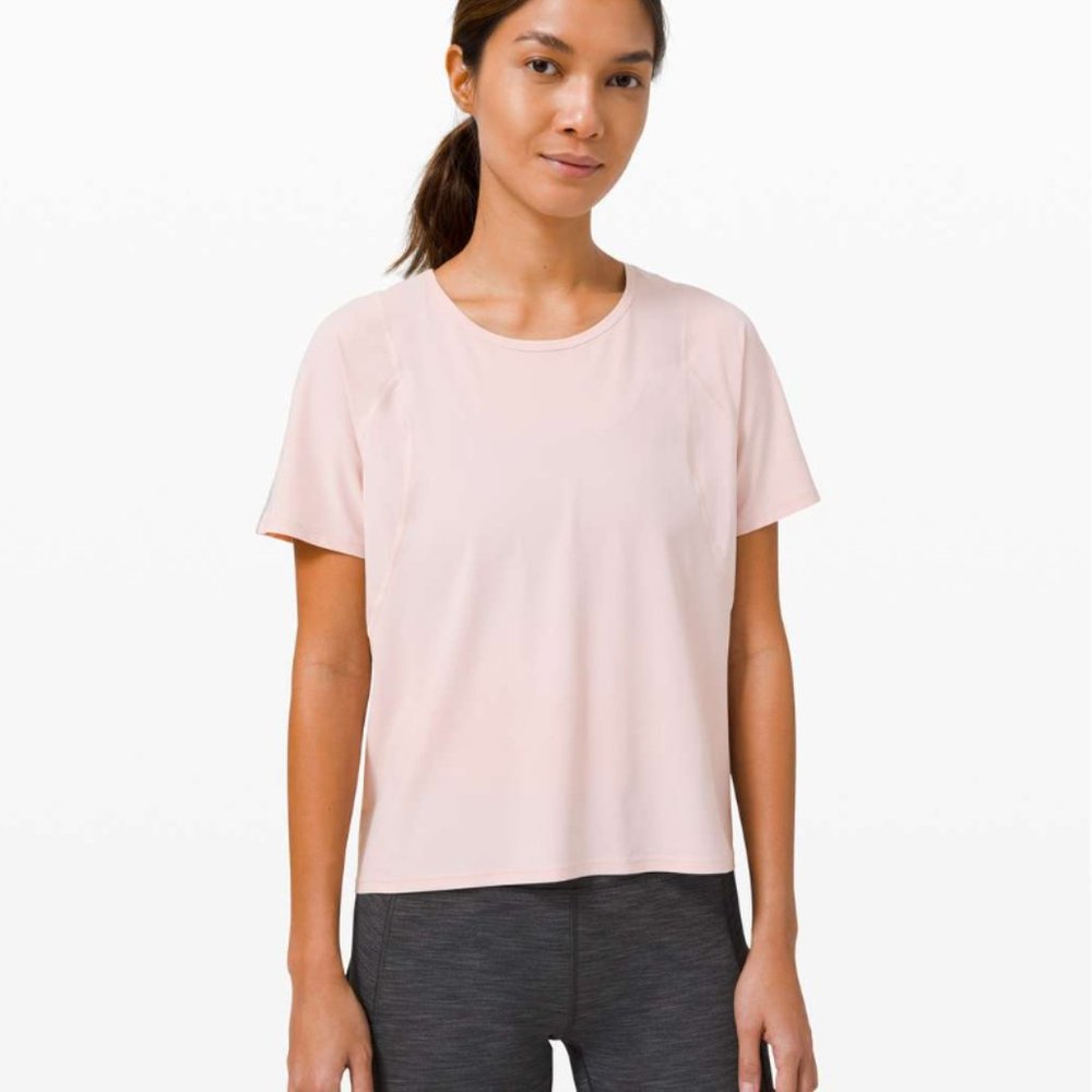 Lululemon Outrun the Heat running top, size 6, porcelain pink color